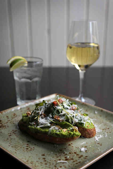 The broccolini presto bruschetta, with prosciutto crudo, arugula, Parmano Reggianoat Forno restaurant in Montgomery.